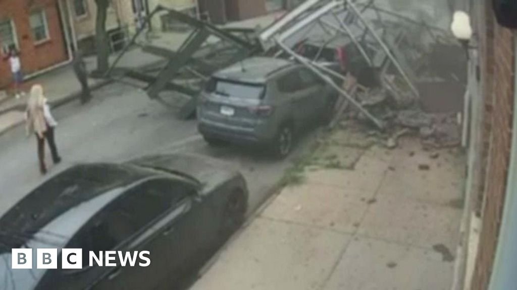 Surveillance video shows the moment empty building collapses